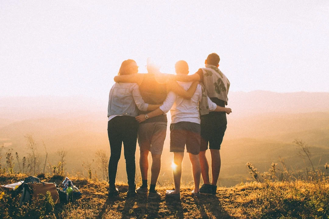 Group of friends standing on top of hill for arkansas detox peak state recovery center